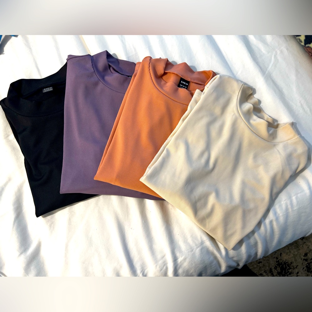Four different colored turtle necks. Size Large. Never before worn.